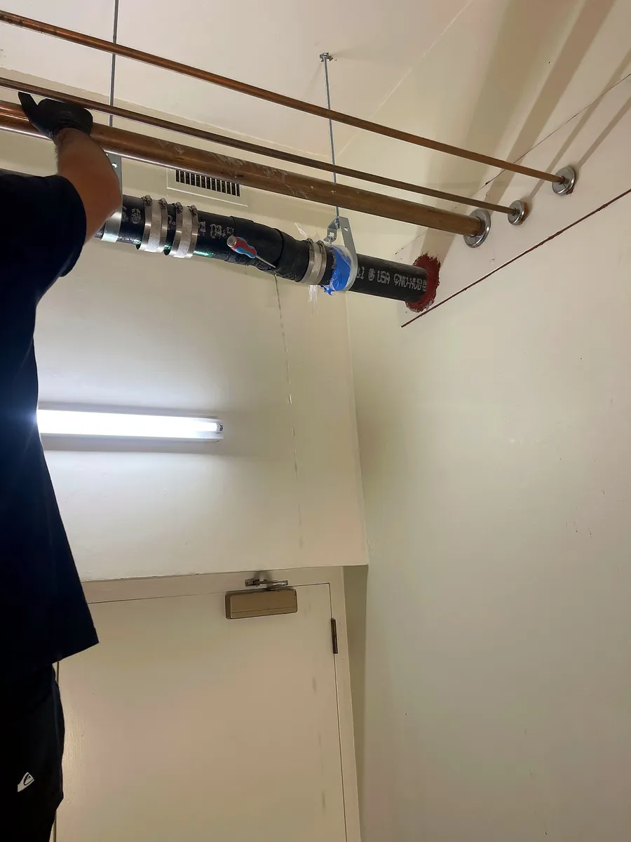 AB Plumbing technician finishing the new drain pipe installation in Palo Alto