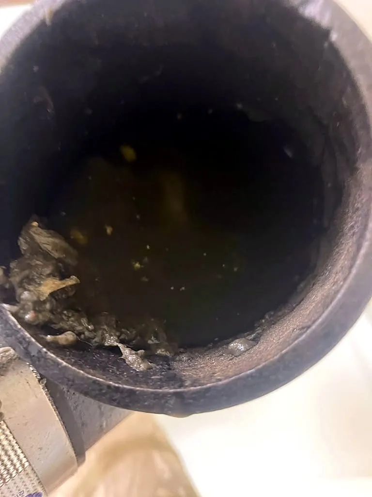Inside of a clogged cast iron drain pipe with heavy buildup in Palo Alto