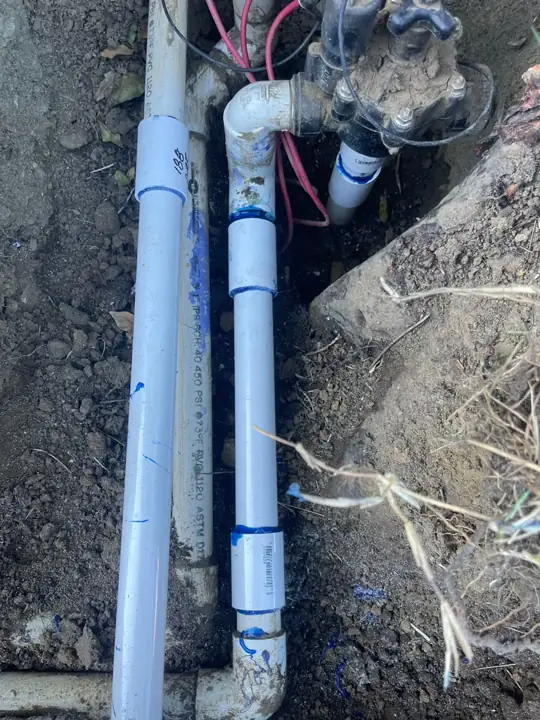 New PVC pipe installed on an irrigation valve