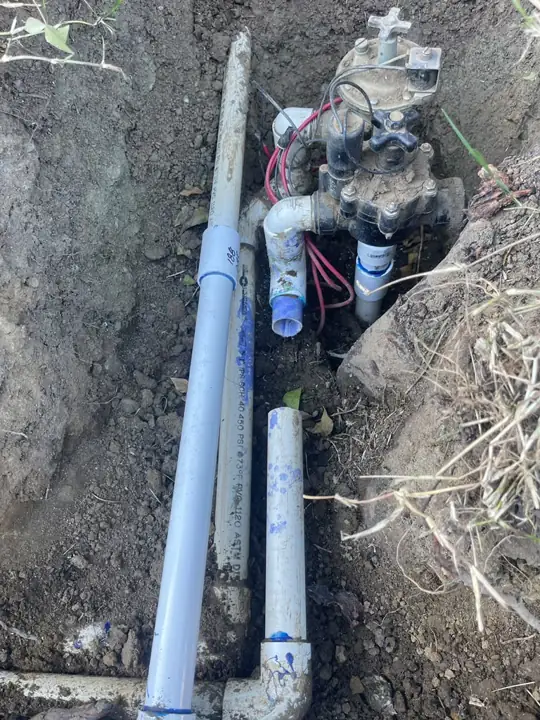 Sprinkler valve replacement with new PVC risers and tee fitting